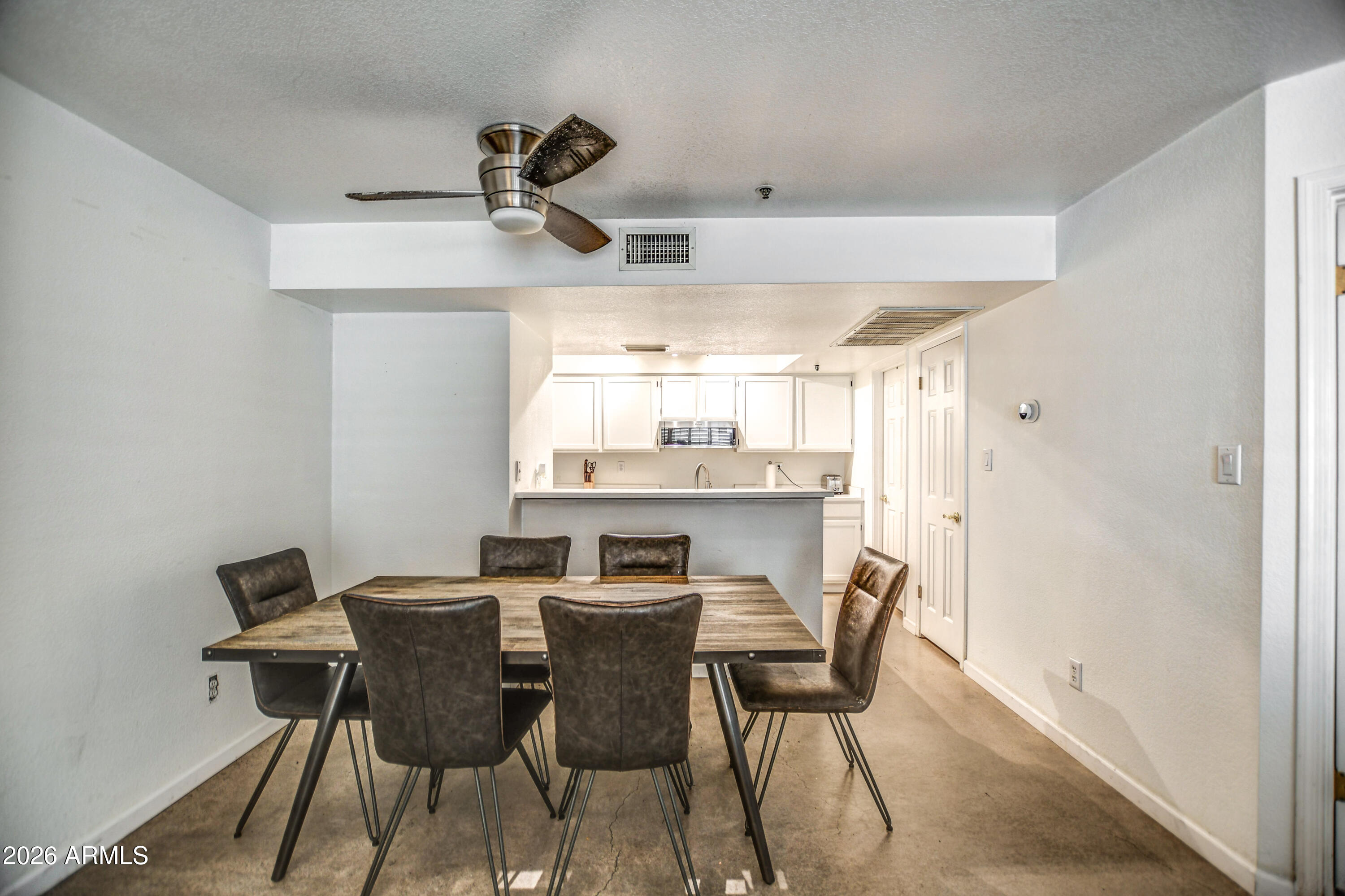 100 East Fillmore Street, Unit 117 Phoenix, AZ 85004 - Photo 9 of 20 a dining room with furniture and window