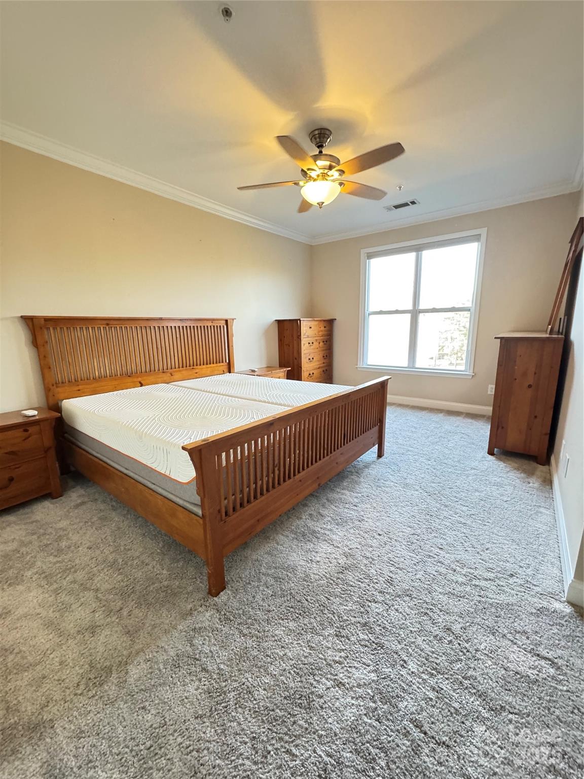 1000 East Woodlawn Road Charlotte, NC 28209 - Photo 21 of 29 a bedroom with a bed and window