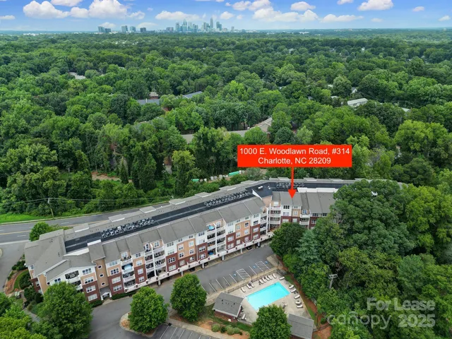 an aerial view of a house with garden space and street view