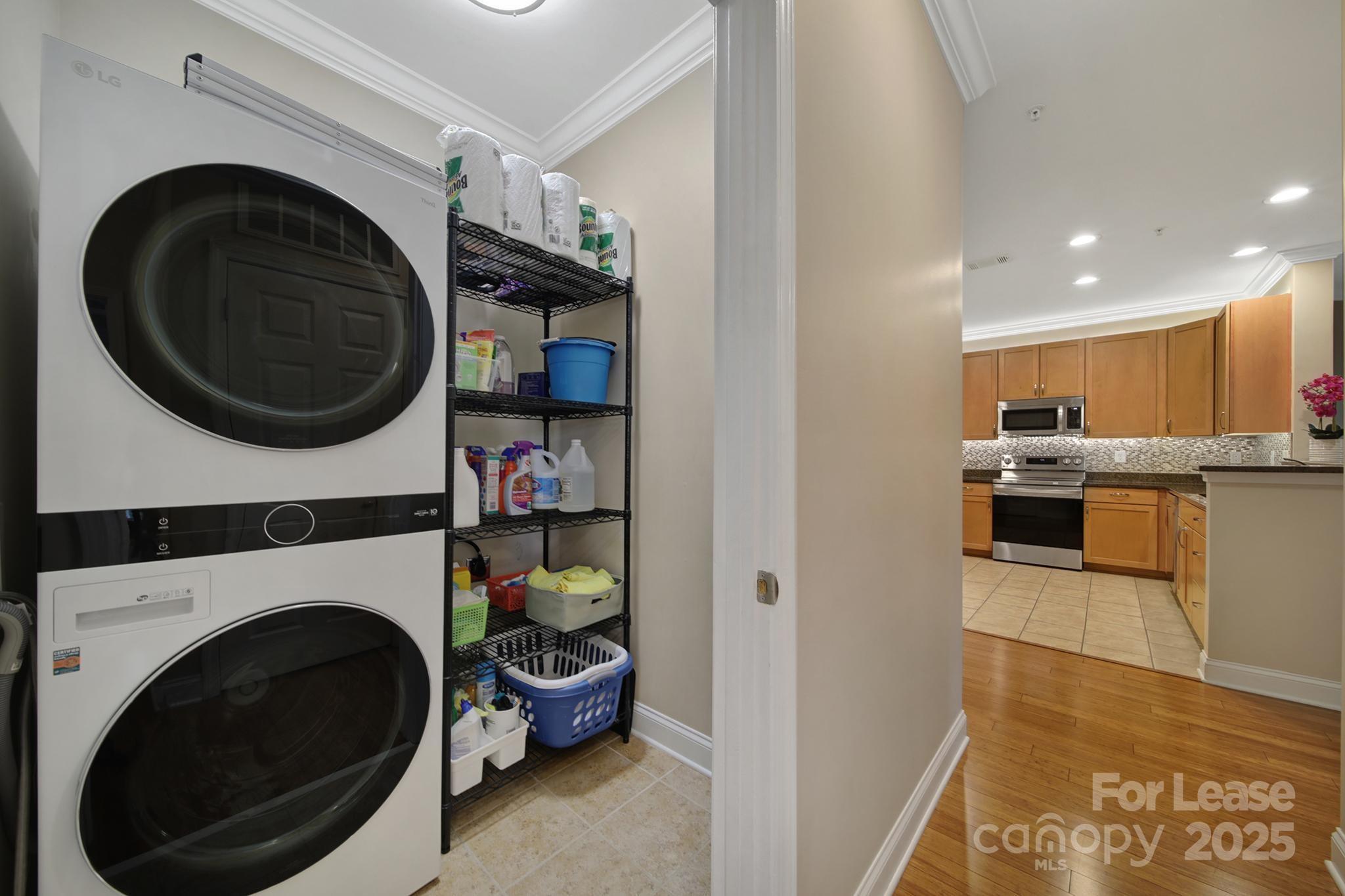 1000 East Woodlawn Road Charlotte, NC 28209 - Photo 5 of 29 a view of a kitchen with a washer and dryer