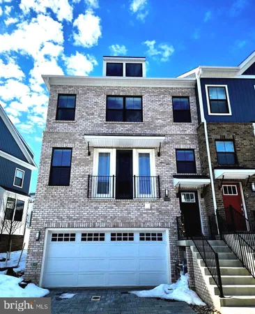 a front view of residential houses with stairs