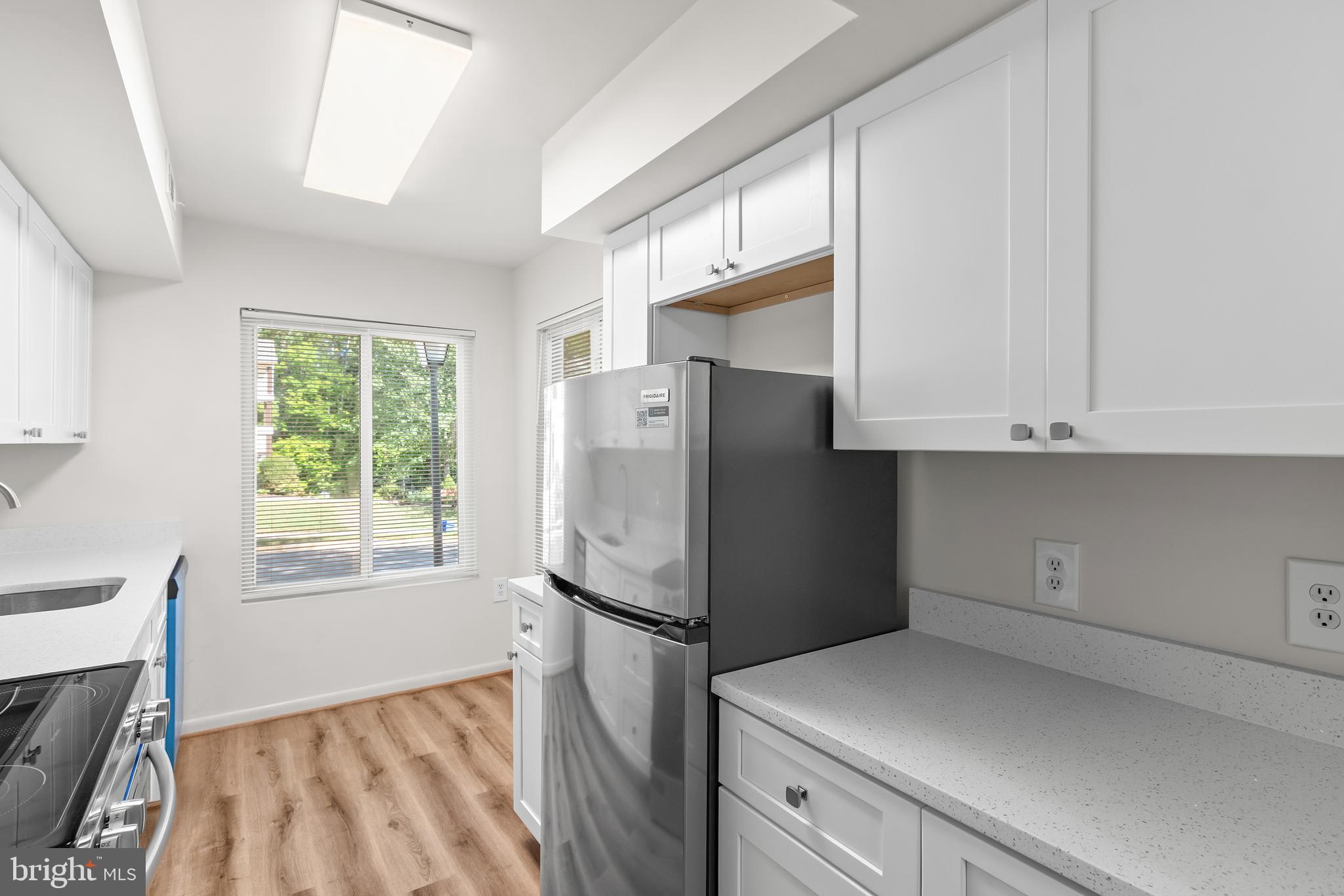 10330 Luria Commons Court, Unit 1B Burke, VA 22015 - Photo 18 of 24 a kitchen with refrigerator and window