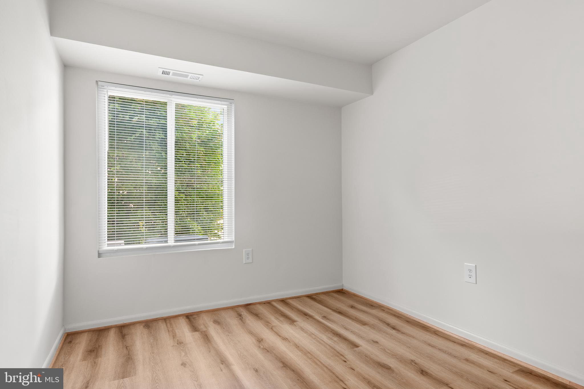 10330 Luria Commons Court, Unit 1B Burke, VA 22015 - Photo 23 of 24 an empty room with a window