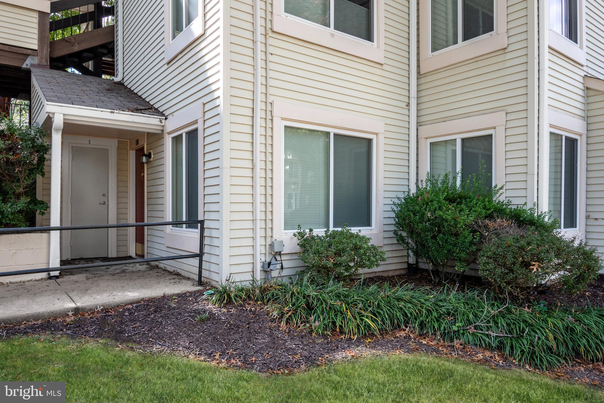 10330 Luria Commons Court, Unit 1B Burke, VA 22015 - Photo 10 of 24 a view of a house with a yard and sitting area