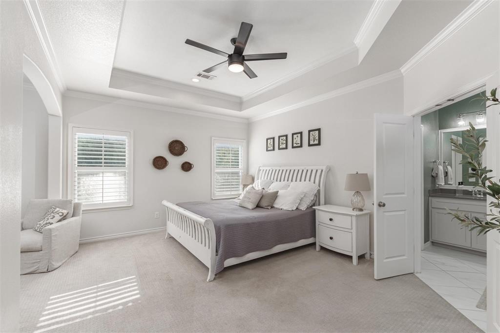 400 Prairie Run Aledo, TX 76008 - Photo 12 of 36 a spacious bedroom with a bed and a chandelier