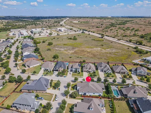 an aerial view of residential houses with outdoor space