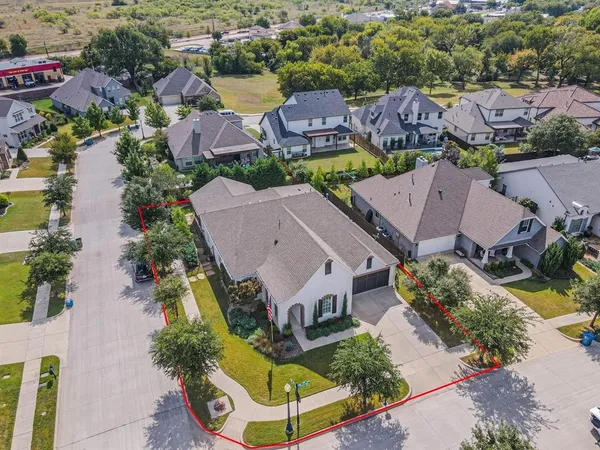 an aerial view of multiple houses with yard