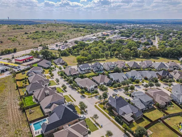 an aerial view of residential houses with outdoor space