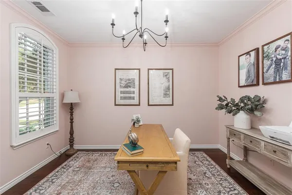 a view of a livingroom with furniture window and wooden floor