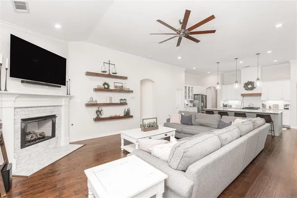a living room with furniture fireplace and a flat screen tv