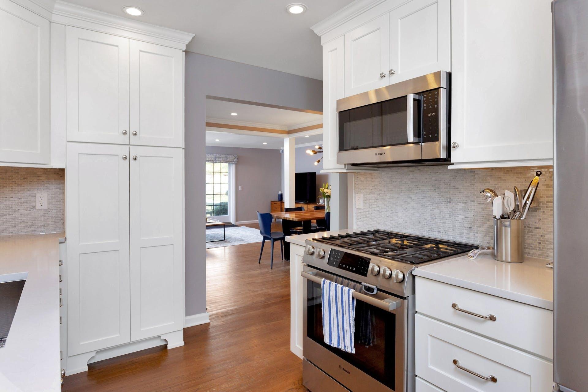 7 Devon Road Darien, CT 06820 - Photo 11 of 29 a kitchen with stainless steel appliances granite countertop a stove and a microwave