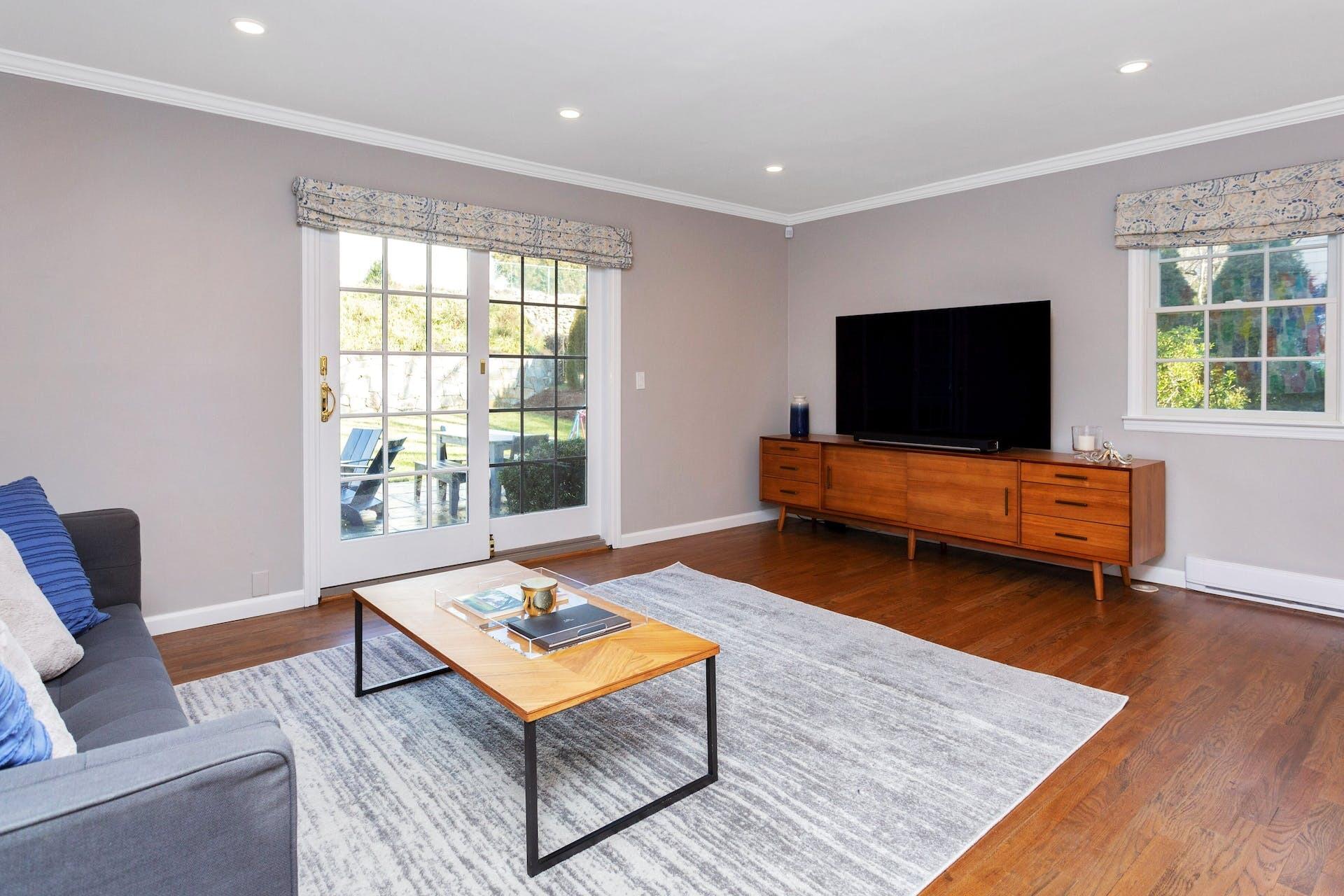 7 Devon Road Darien, CT 06820 - Photo 15 of 29 a living room with furniture and a flat screen tv