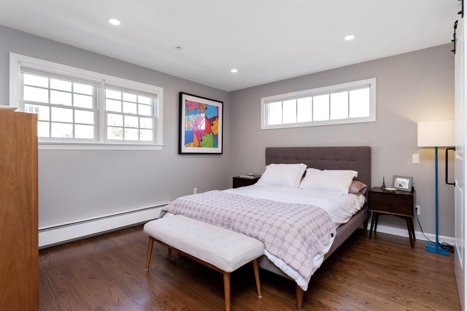 7 Devon Road Darien, CT 06820 - Photo 18 of 29 a bedroom with a bed and wooden floor