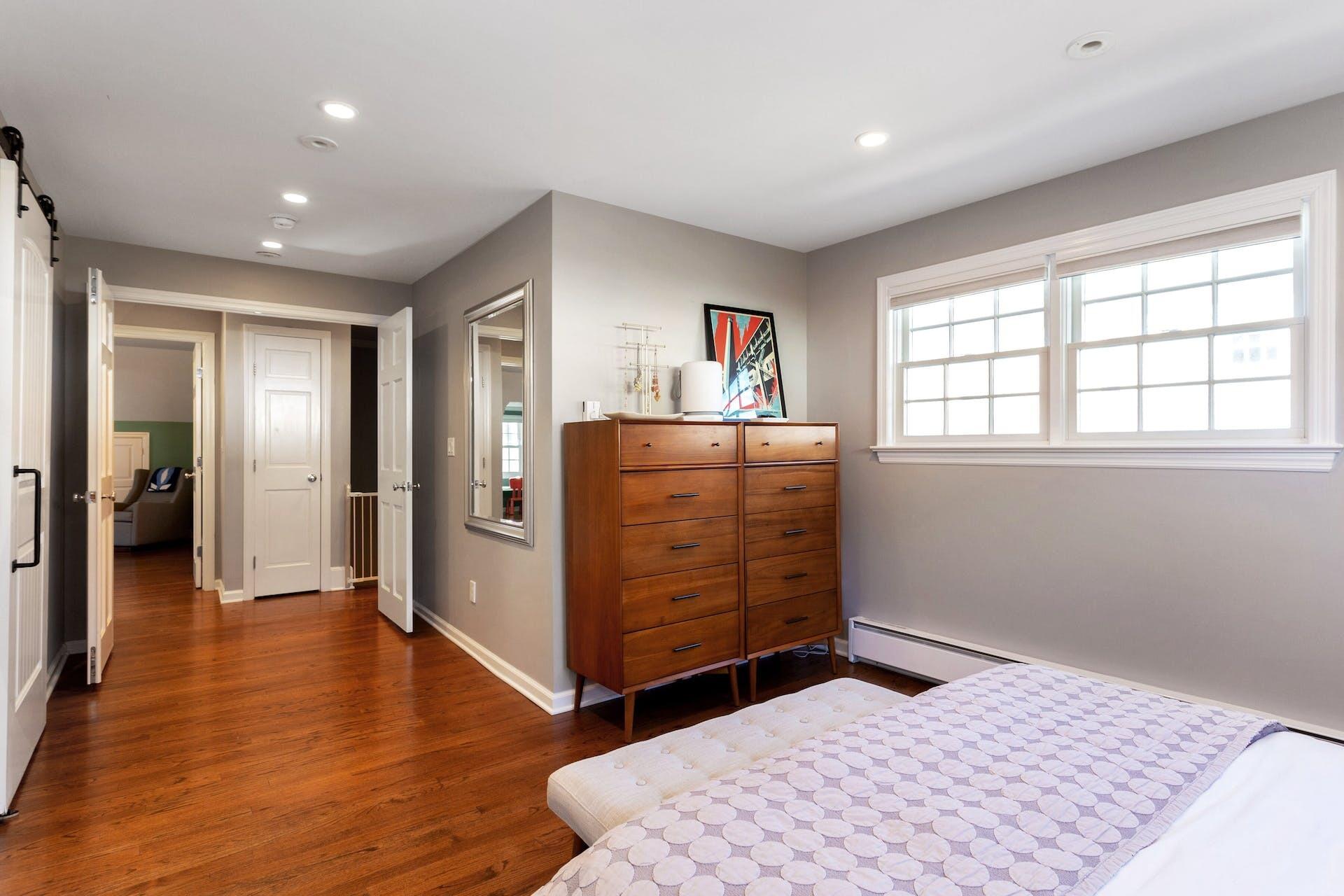 7 Devon Road Darien, CT 06820 - Photo 19 of 29 a bedroom with a bed and a dresser