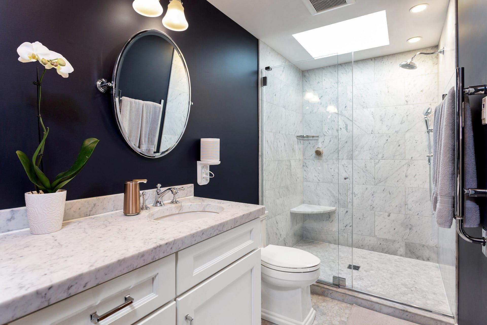 7 Devon Road Darien, CT 06820 - Photo 21 of 29 a bathroom with a toilet a sink and shower
