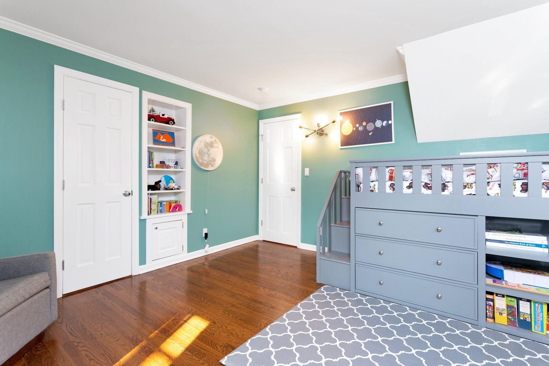 7 Devon Road Darien, CT 06820 - Photo 23 of 29 a bedroom with a bed and a dresser in it