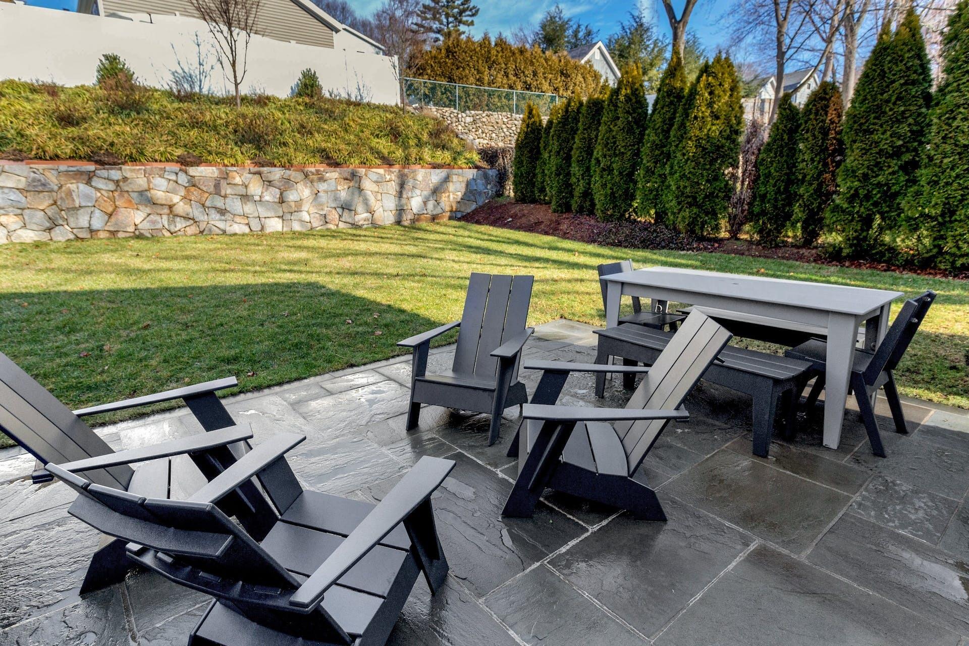 7 Devon Road Darien, CT 06820 - Photo 26 of 29 a view of a swimming pool and lounge chairs