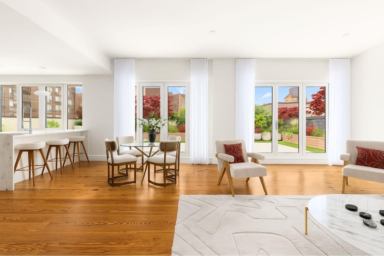 427 East 90th Street, Unit PH9 Manhattan, NY 10128 - Photo 20 of 37 a living room with furniture and floor to ceiling windows