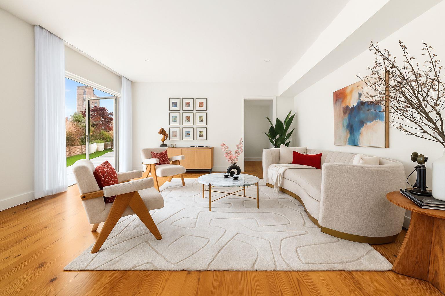 427 East 90th Street, Unit PH9 Manhattan, NY 10128 - Photo 22 of 37 a living room with furniture and a table