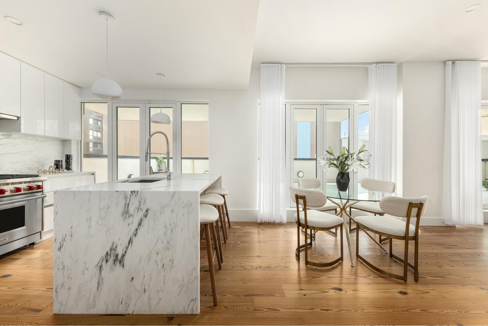 427 East 90th Street, Unit PH9 Manhattan, NY 10128 - Photo 23 of 37 a living room with furniture and wooden floor