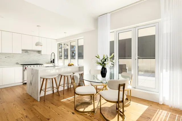 a bedroom with a large bed and a large window