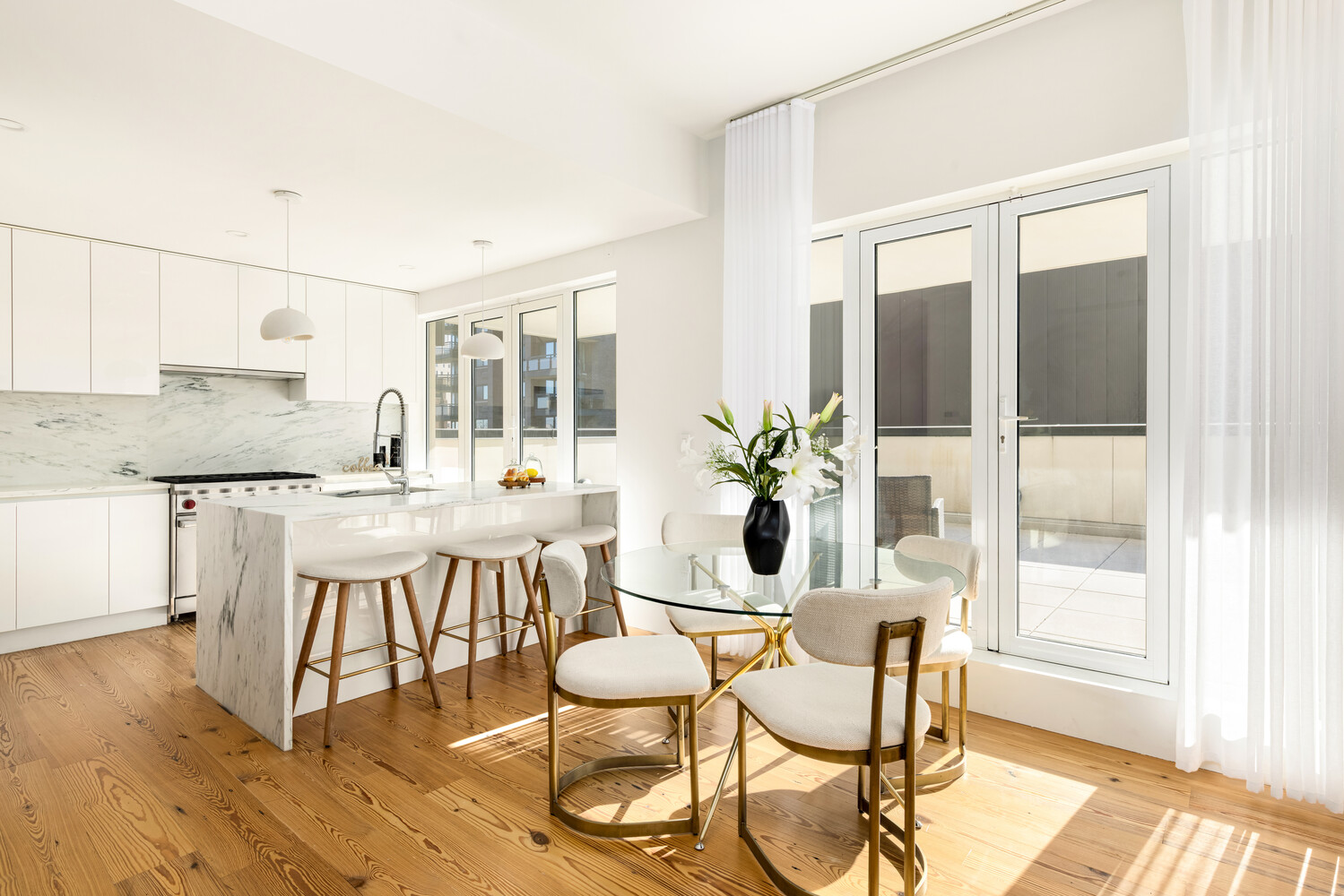 427 East 90th Street, Unit PH9 Manhattan, NY 10128 - Photo 5 of 37 a dining room with furniture and wooden floor