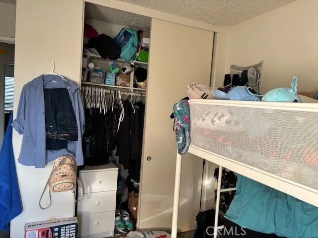a living room with furniture and a clock