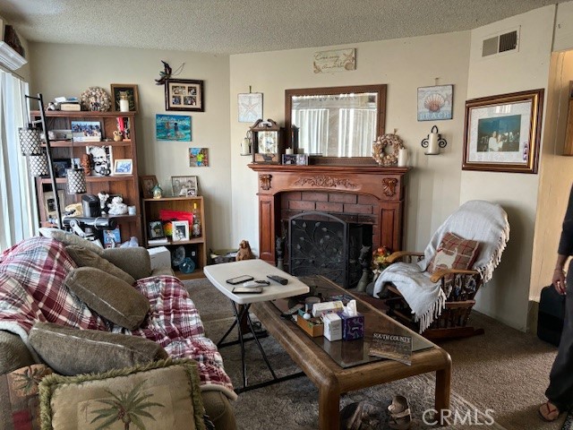 33371 Cheltam Way, Unit 2 Dana Point, CA 92629 - Photo 3 of 15 a living room with furniture and a fireplace