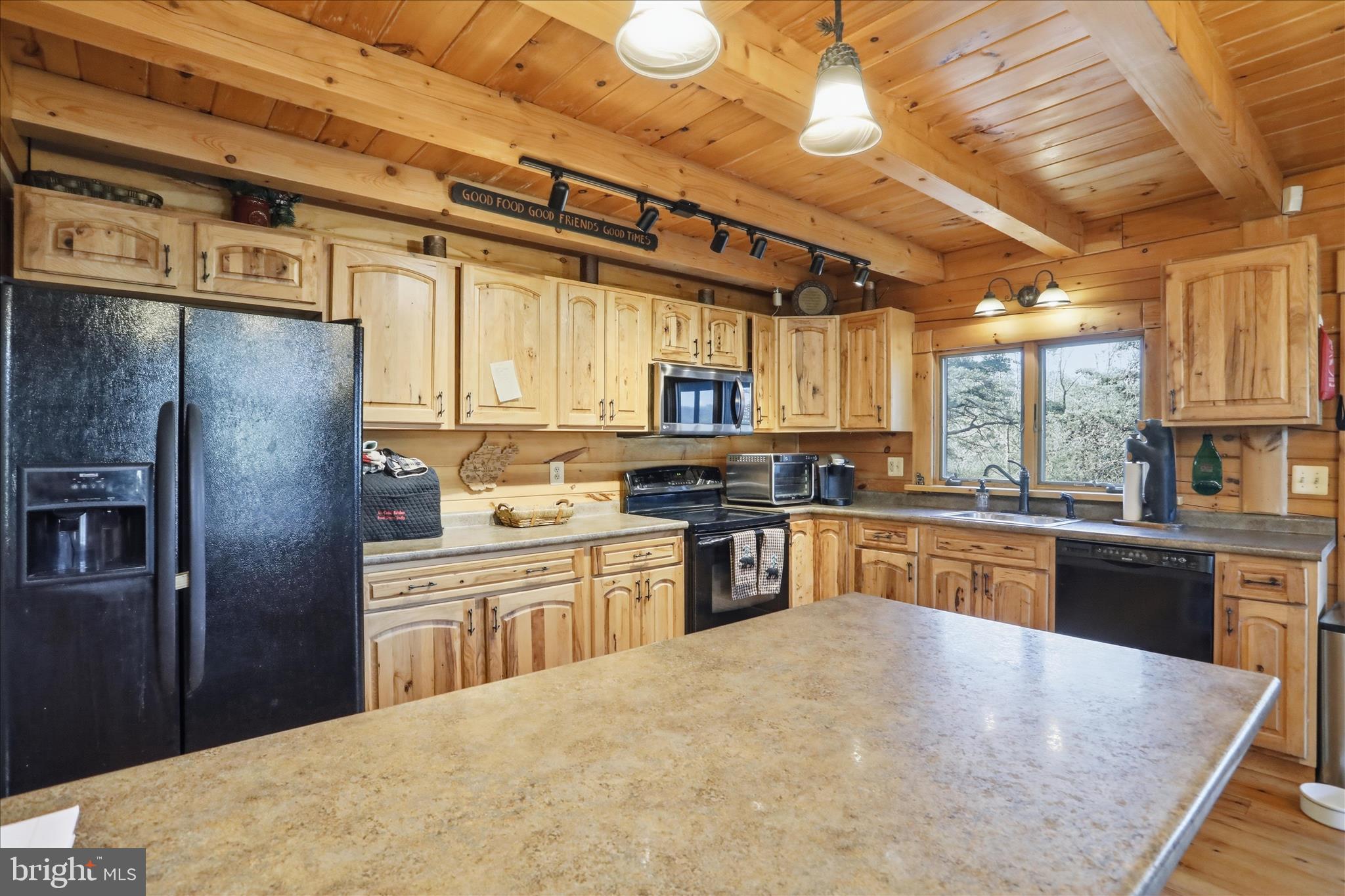 4 Parsons Ridge Road Romney, WV 26757 - Photo 14 of 58 a large kitchen with cabinets and stainless steel appliances