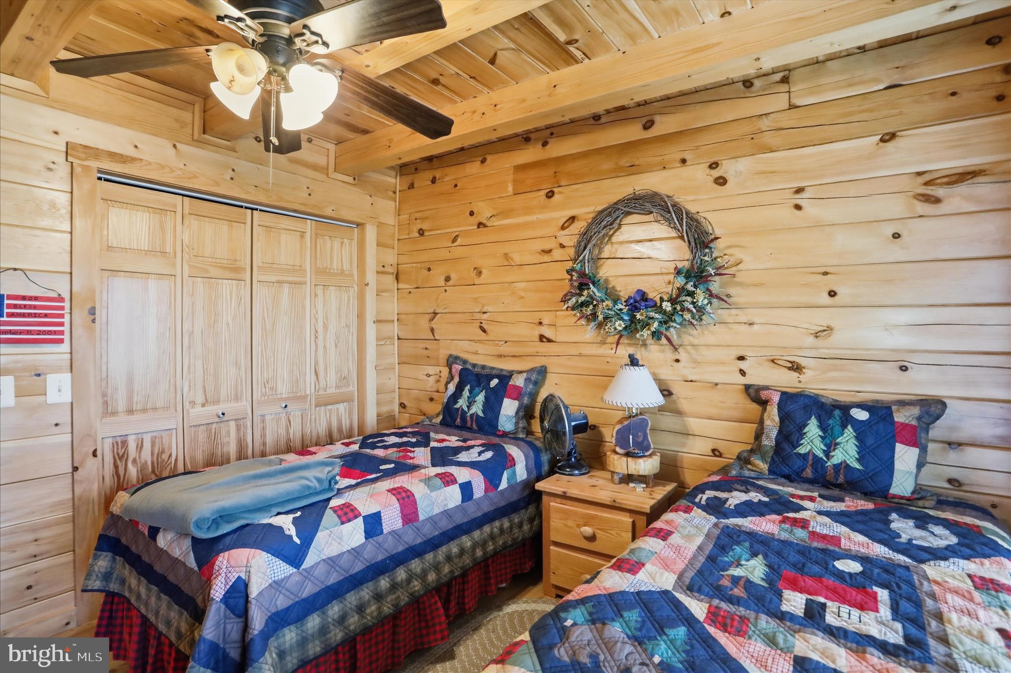 4 Parsons Ridge Road Romney, WV 26757 - Photo 29 of 58 a bedroom with bed and a chandelier