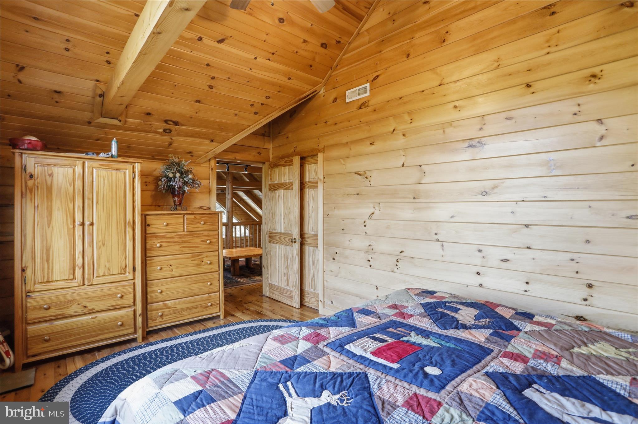 4 Parsons Ridge Road Romney, WV 26757 - Photo 31 of 58 a bedroom with a bed and a dresser