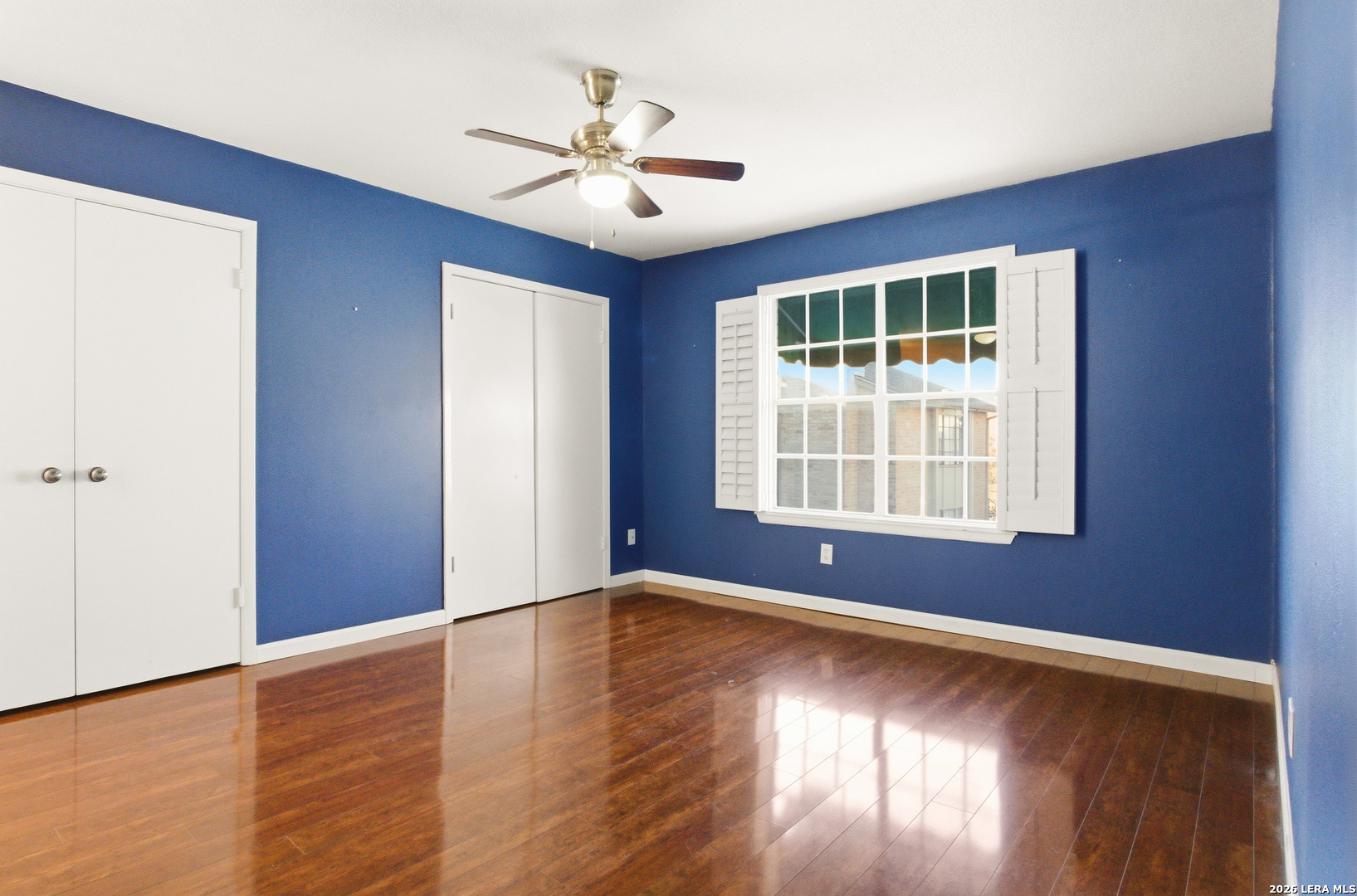 7711 Callaghan Road, Unit 404 San Antonio, TX 78229 - Photo 20 of 39 a view of empty room with wooden floor and fan