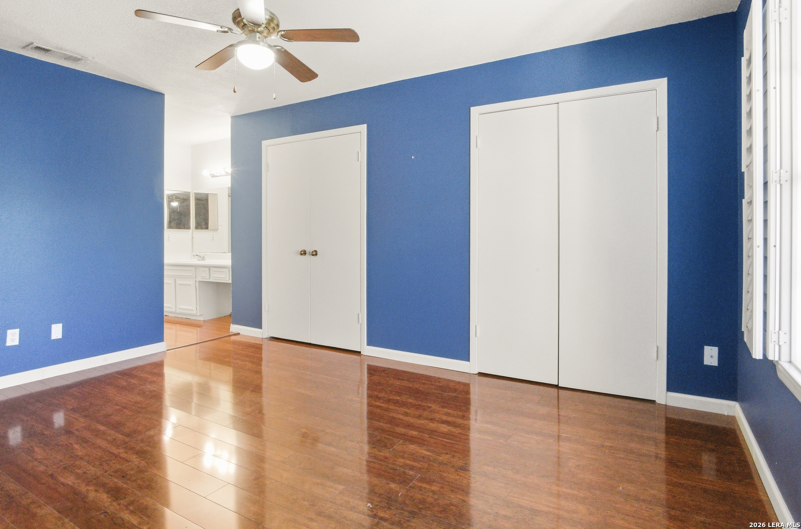 7711 Callaghan Road, Unit 404 San Antonio, TX 78229 - Photo 21 of 39 a view of an empty room with wooden floor and a window