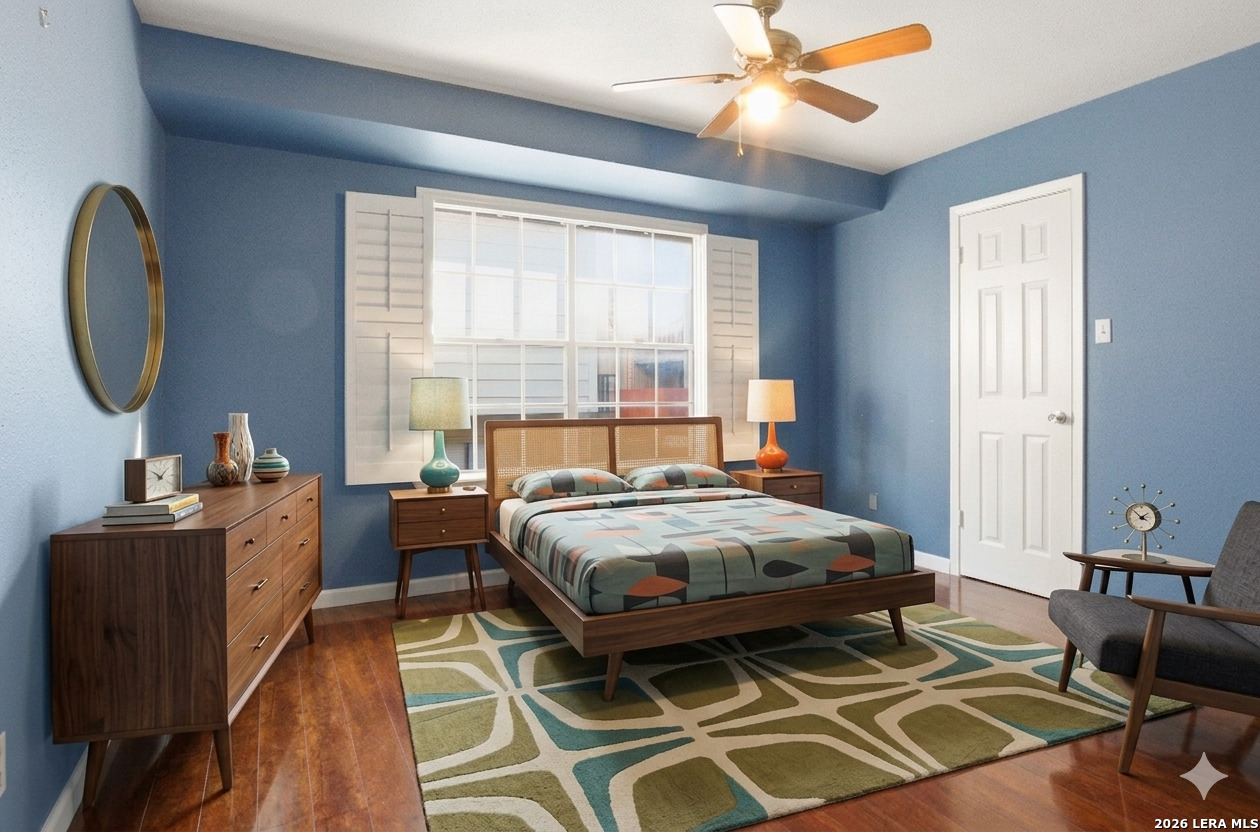 7711 Callaghan Road, Unit 404 San Antonio, TX 78229 - Photo 25 of 39 a bedroom with a bed and a chandelier