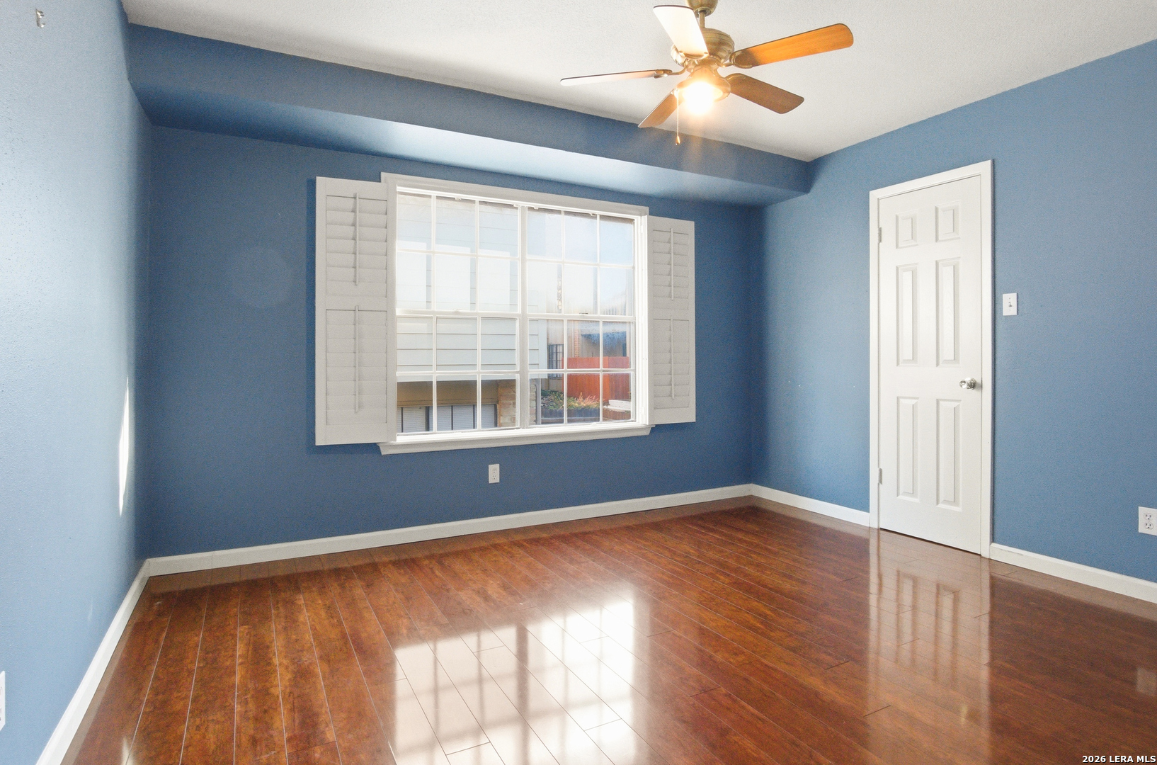 7711 Callaghan Road, Unit 404 San Antonio, TX 78229 - Photo 26 of 39 wooden floor and window in an empty room