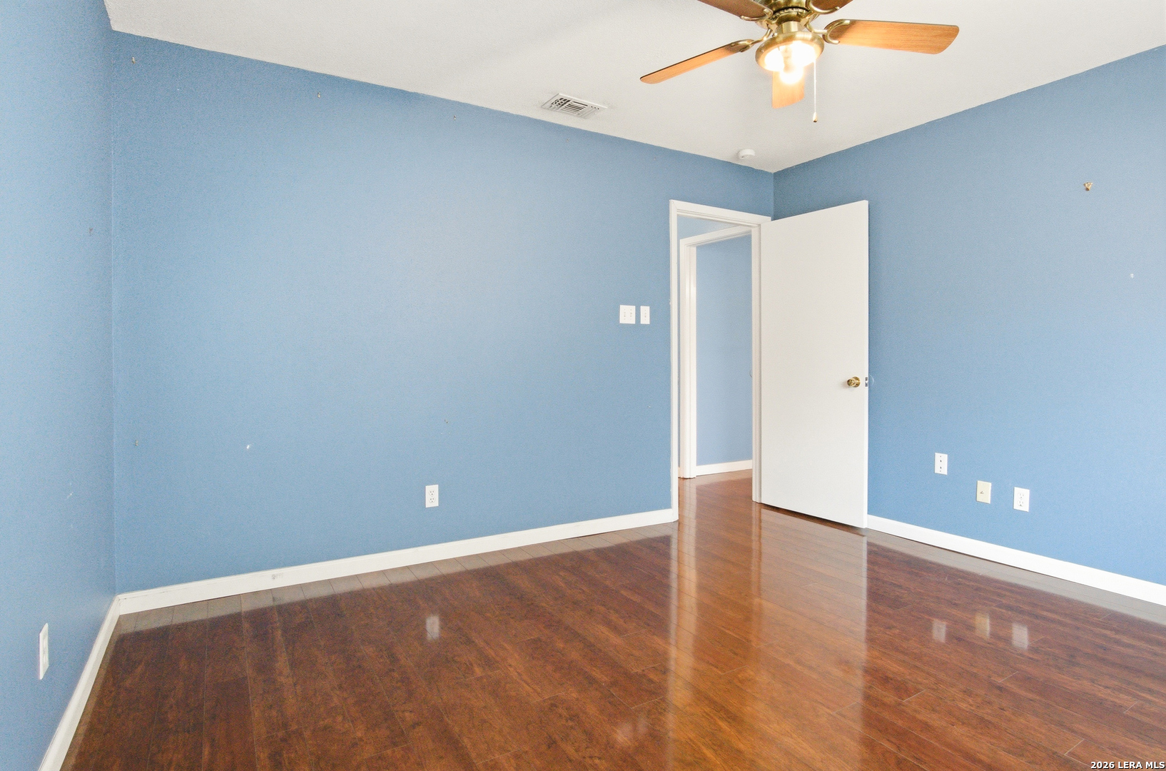 7711 Callaghan Road, Unit 404 San Antonio, TX 78229 - Photo 27 of 39 a view of an empty room with a chandelier fan