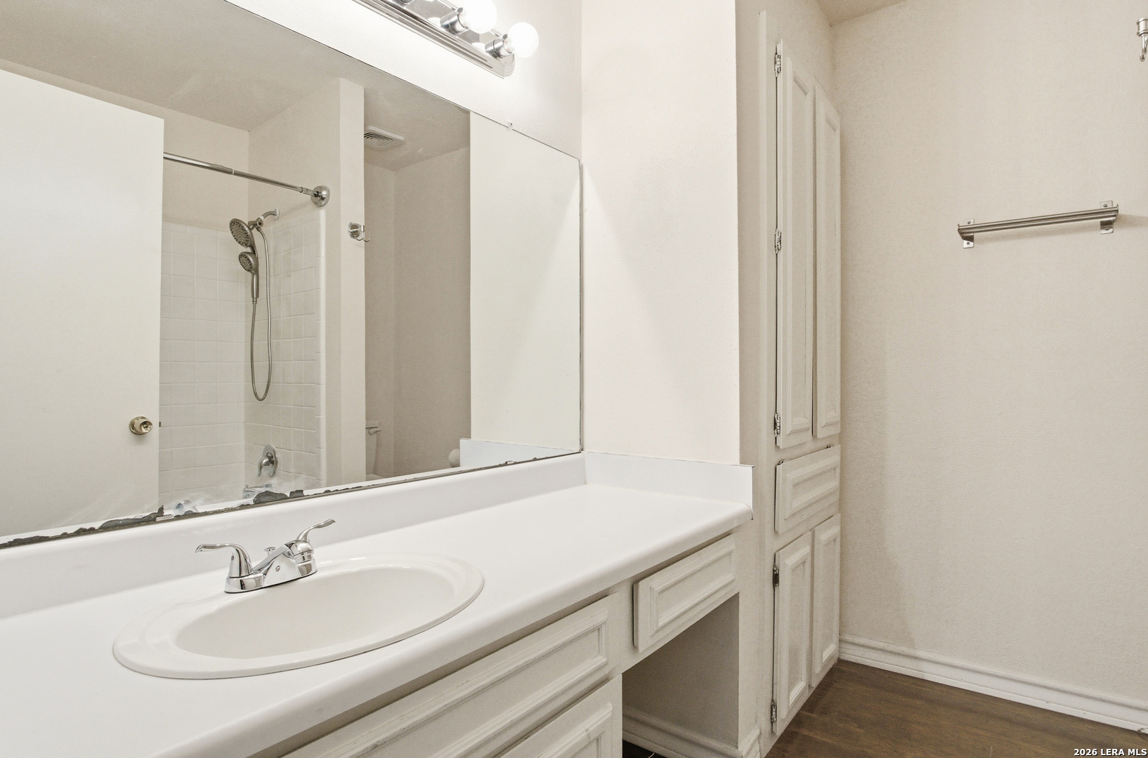 7711 Callaghan Road, Unit 404 San Antonio, TX 78229 - Photo 28 of 39 a bathroom with a sink and a mirror
