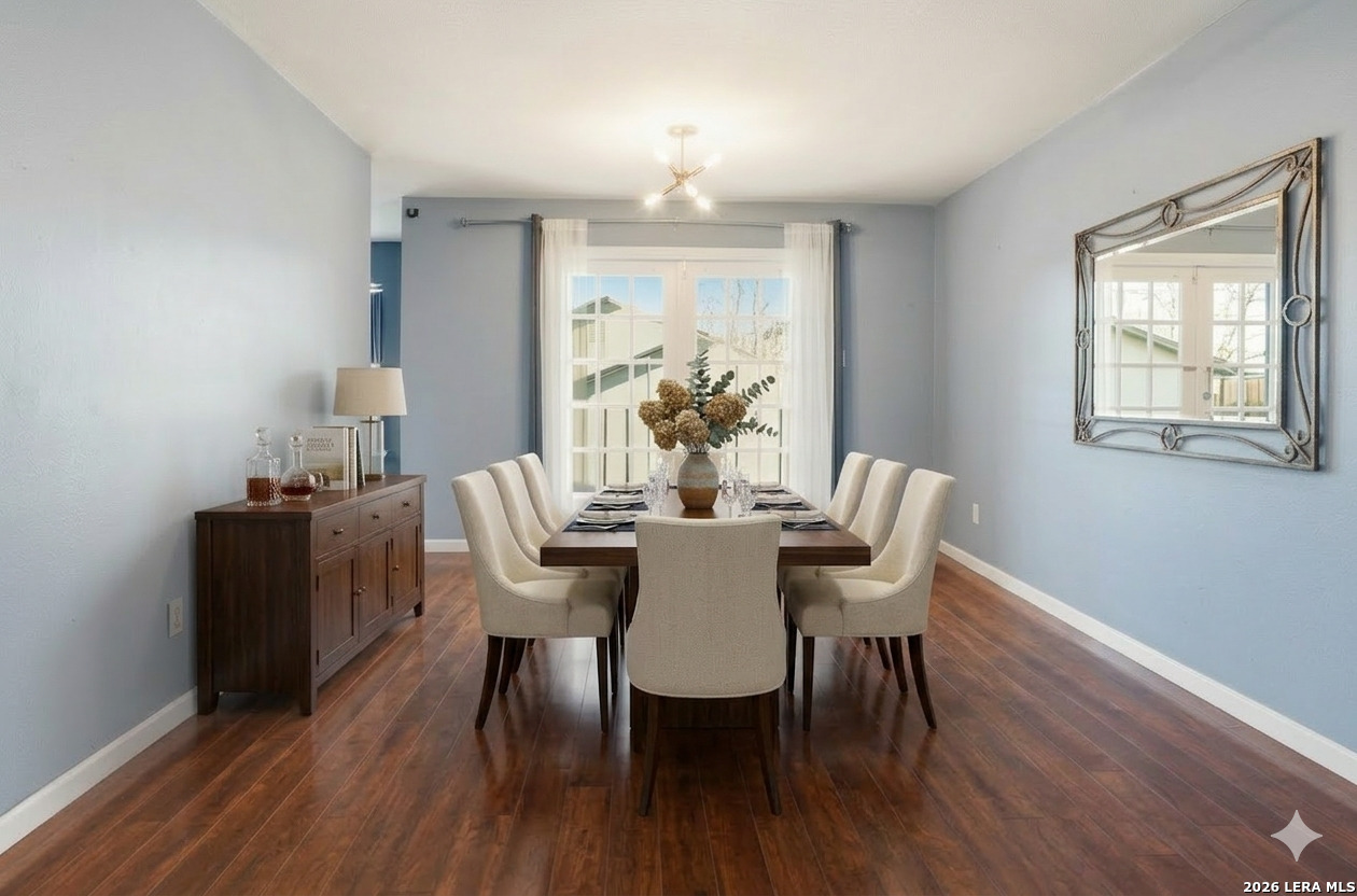 7711 Callaghan Road, Unit 404 San Antonio, TX 78229 - Photo 3 of 39 a view of a dining room with furniture window and wooden floor