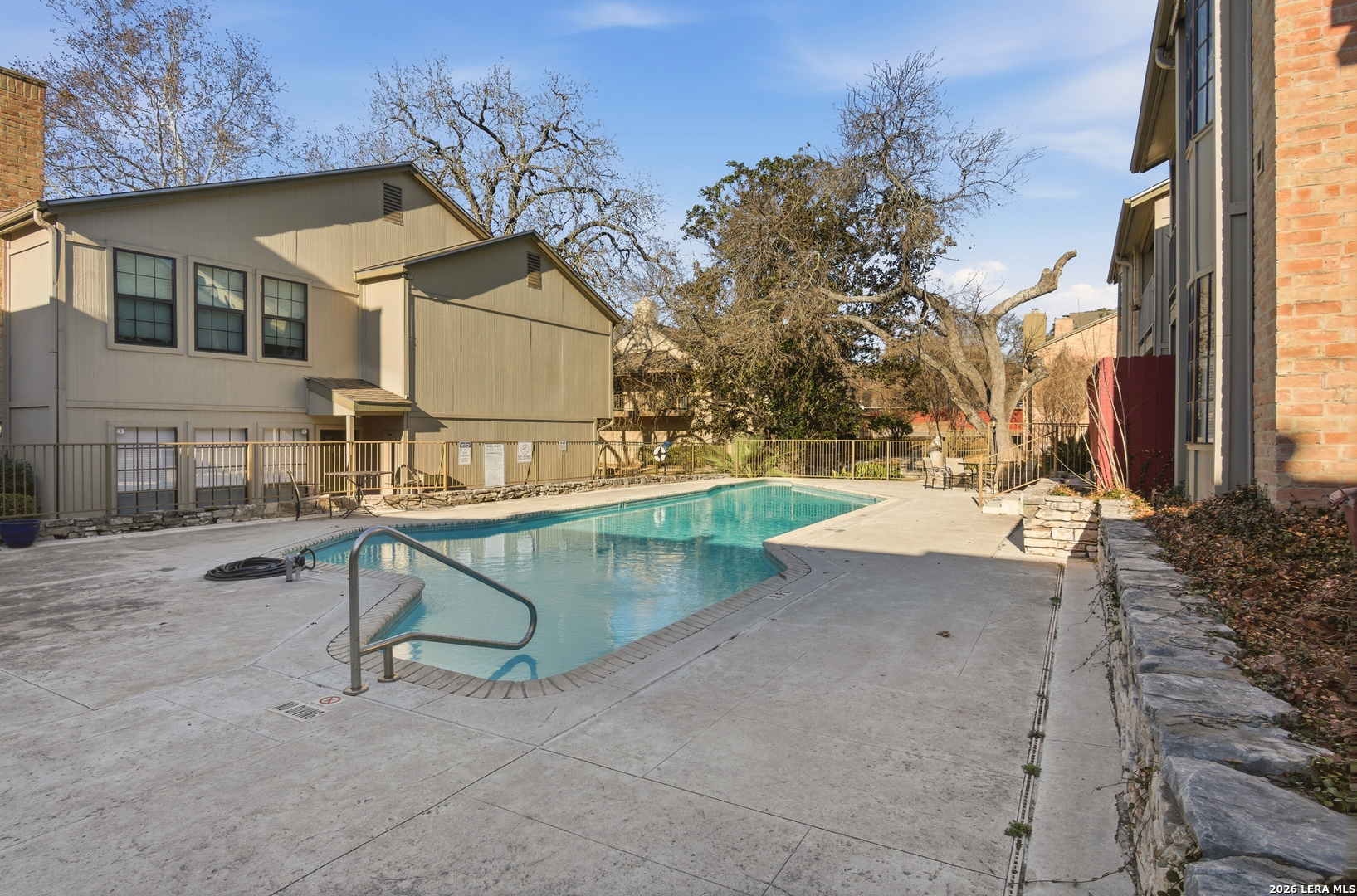 7711 Callaghan Road, Unit 404 San Antonio, TX 78229 - Photo 32 of 39 a view of backyard with a table and chairs