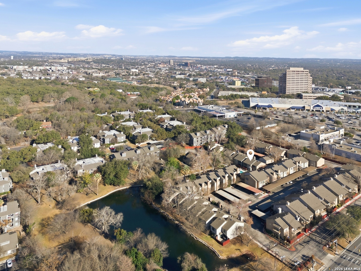 7711 Callaghan Road, Unit 404 San Antonio, TX 78229 - Photo 35 of 39 an aerial view of residential building with parking space