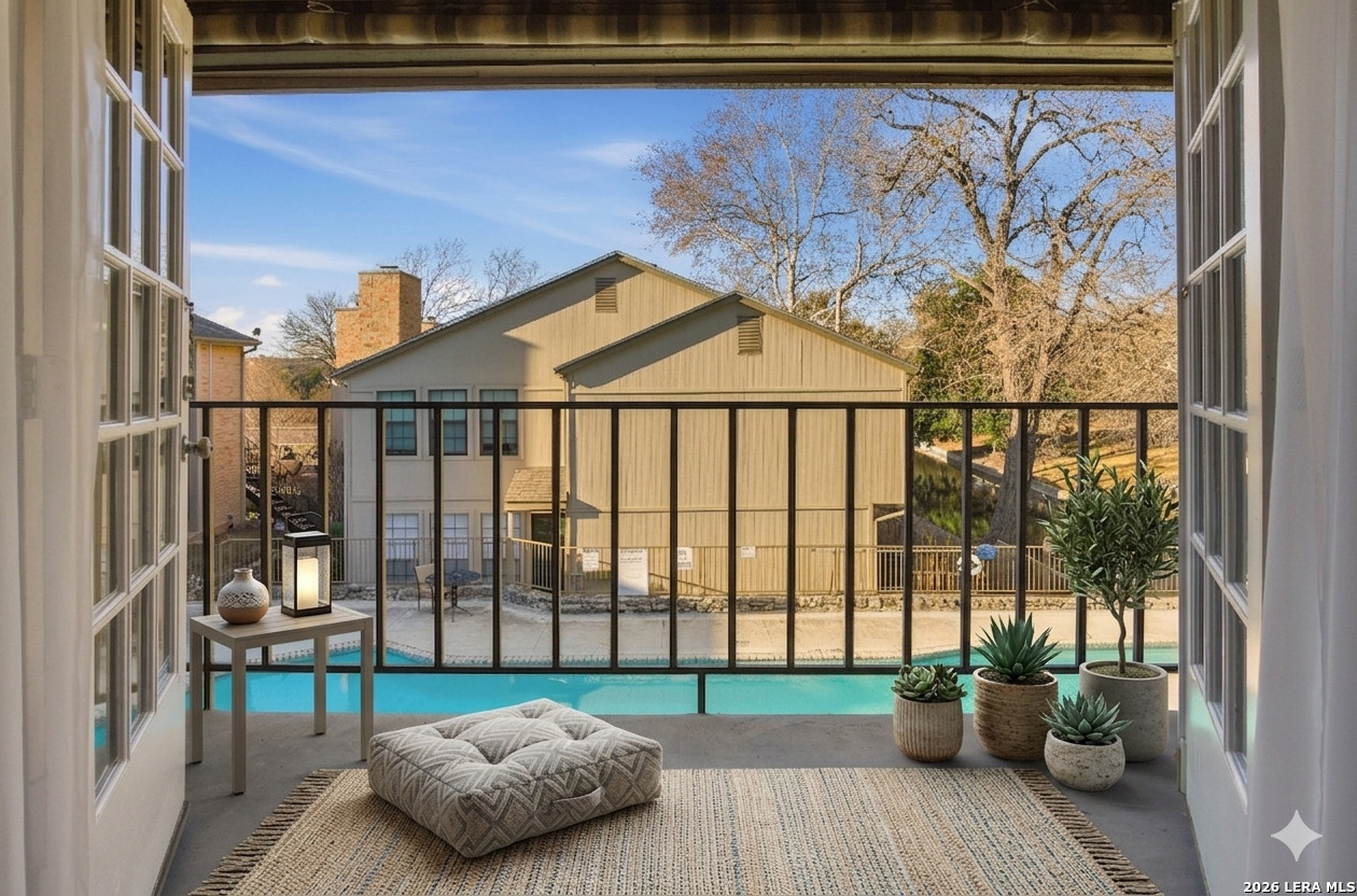 7711 Callaghan Road, Unit 404 San Antonio, TX 78229 - Photo 5 of 39 a view of a porch with furniture and garden