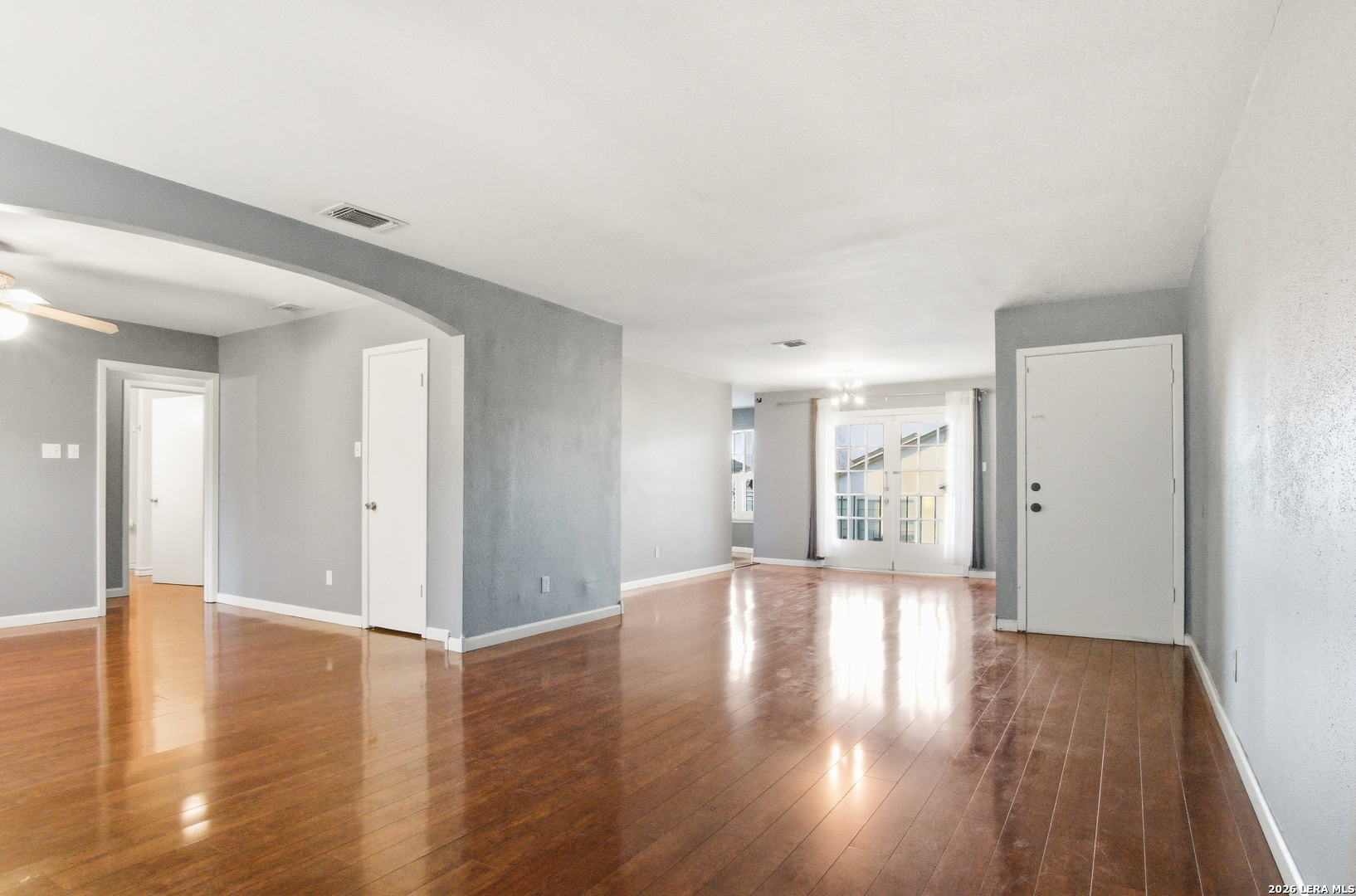 7711 Callaghan Road, Unit 404 San Antonio, TX 78229 - Photo 7 of 39 a view of an empty room with wooden floor