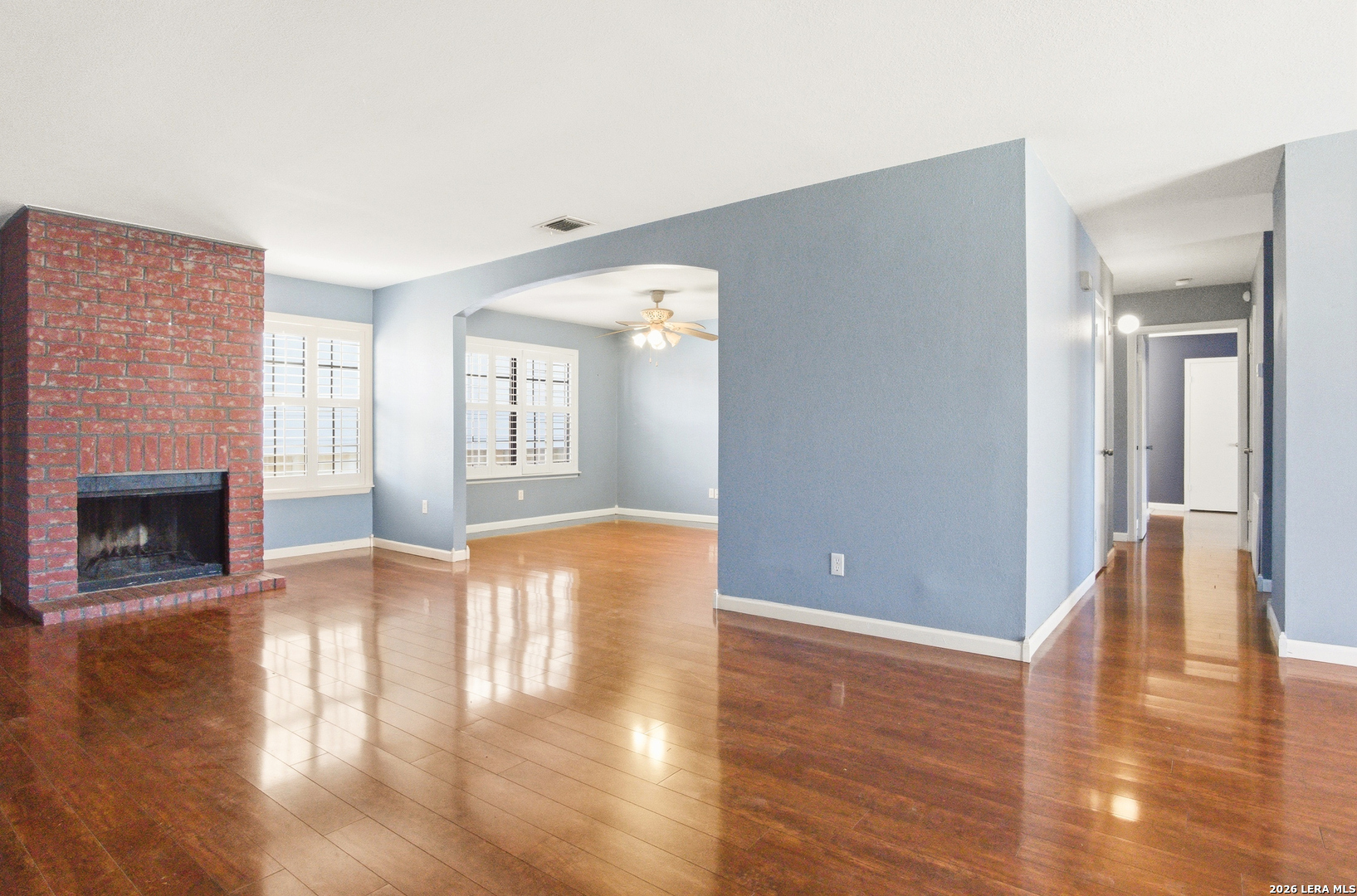 7711 Callaghan Road, Unit 404 San Antonio, TX 78229 - Photo 8 of 39 a view of an empty room with window and wooden floor