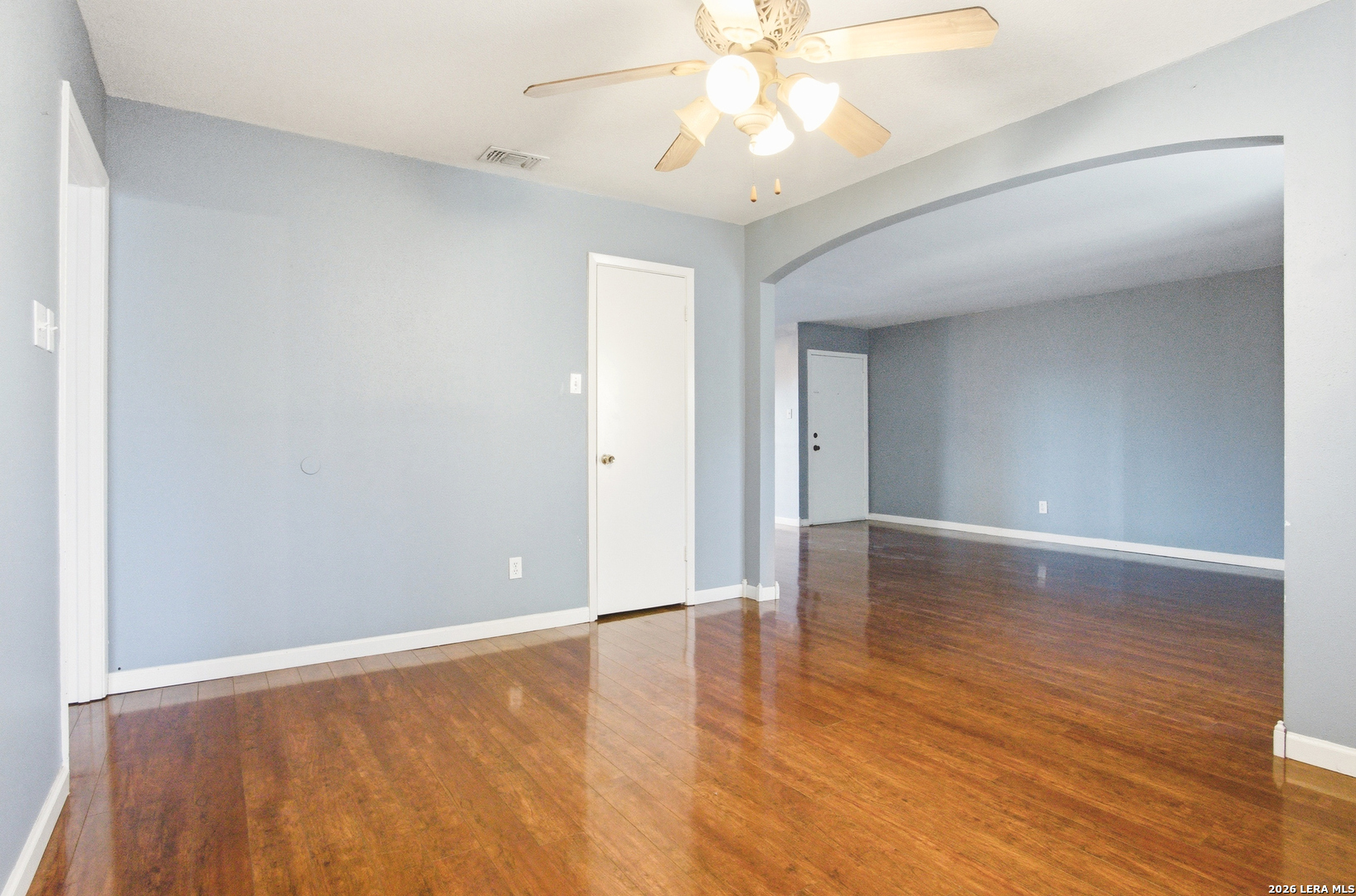 7711 Callaghan Road, Unit 404 San Antonio, TX 78229 - Photo 9 of 39 wooden floor in an empty room with a window