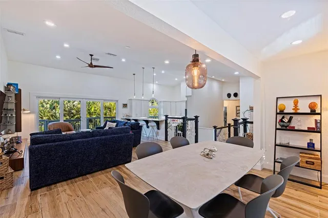 a living room with furniture a rug and a large window