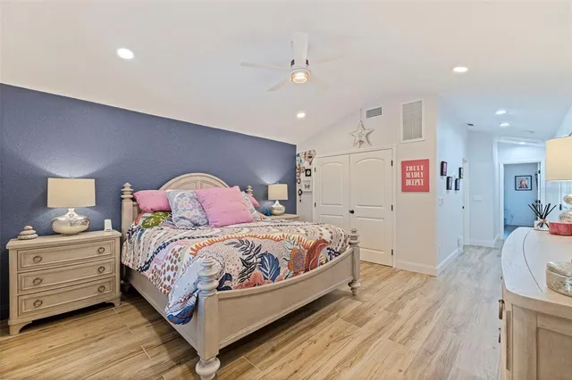 a bedroom with a bed and a dresser