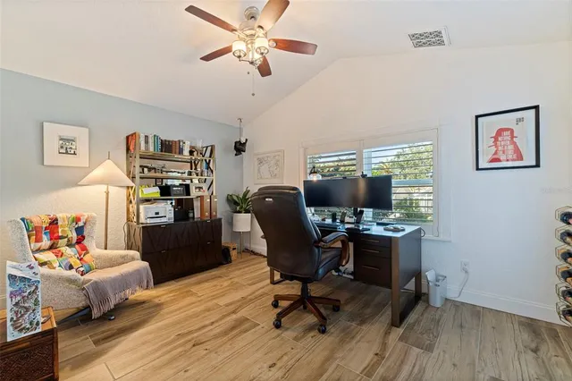 a work room with furniture and wooden floor