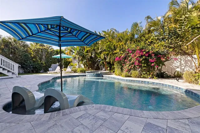 a view of a swimming pool with a patio