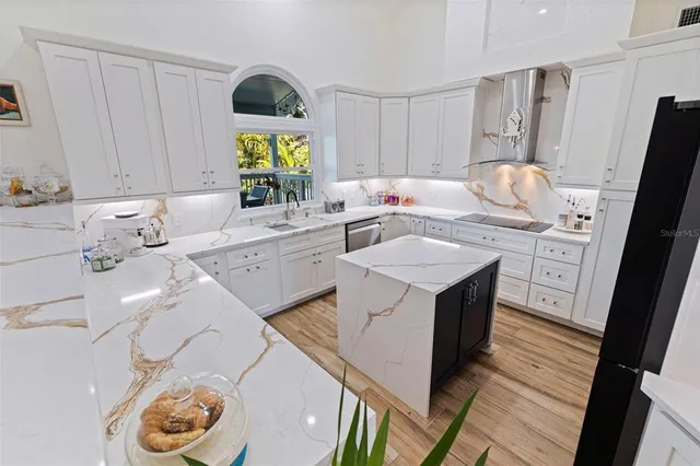 a kitchen with a stove and cabinets
