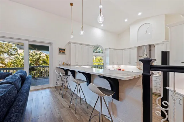 a kitchen with stainless steel appliances kitchen island a large island in the center